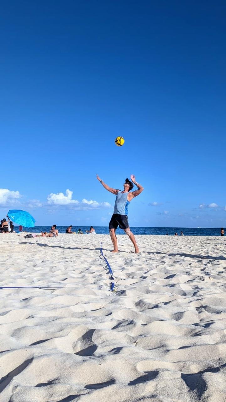 Javi playing beach volleyball after his recovery journey